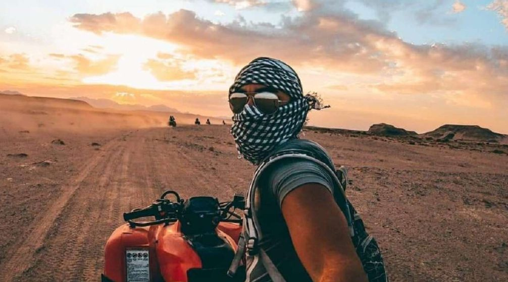Sunset Desert Safari by Quad Bike with BBQ Dinner from Soma Bay