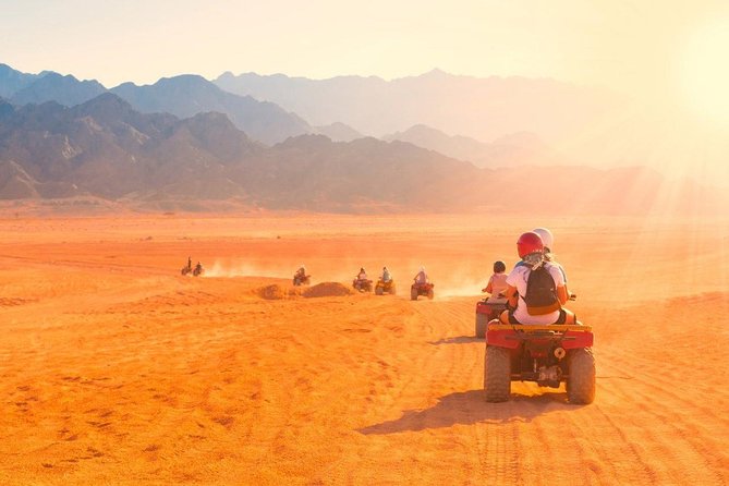 Sunset Desert Safari by Quad Bike with BBQ Dinner from Soma Bay